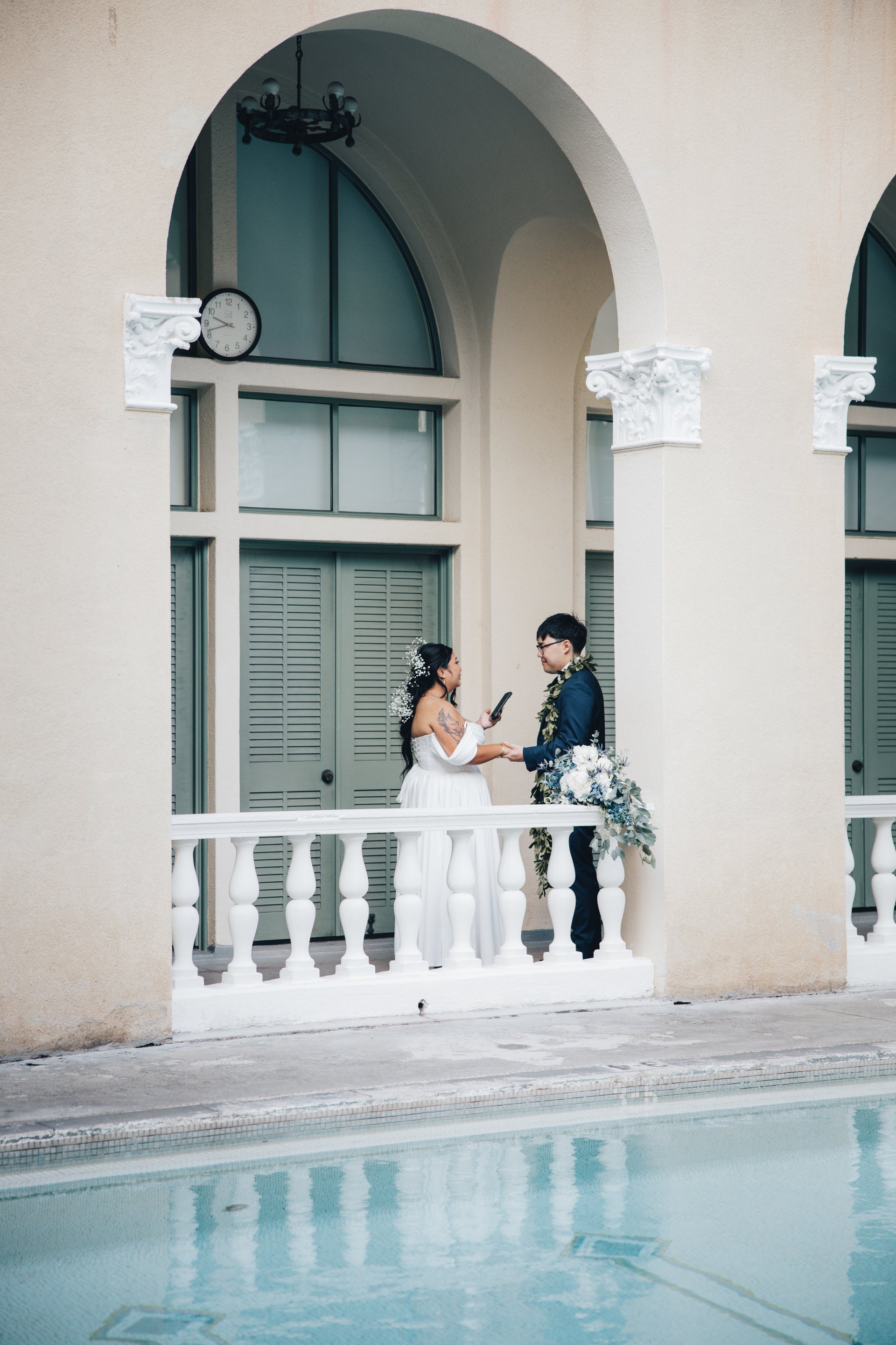 Newlyweds share first kiss on steps of historic YWCA Honolulu wedding venue