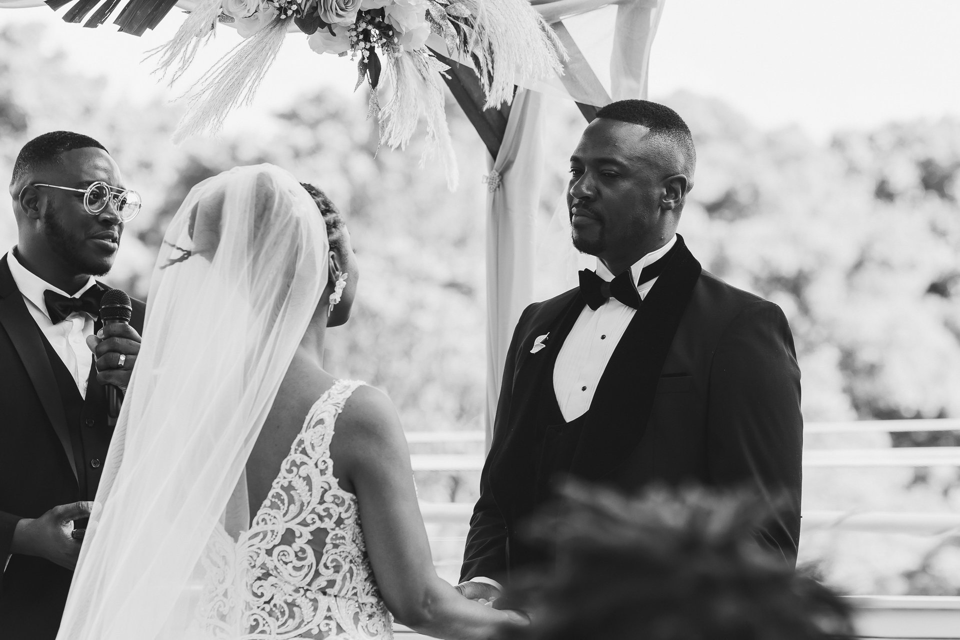 Black and white editorial portrait of bride and groom during Hawaii wedding ceremony